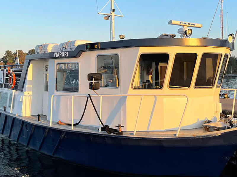 The passenger ferry "Viapori" illuminated by the evening sun.