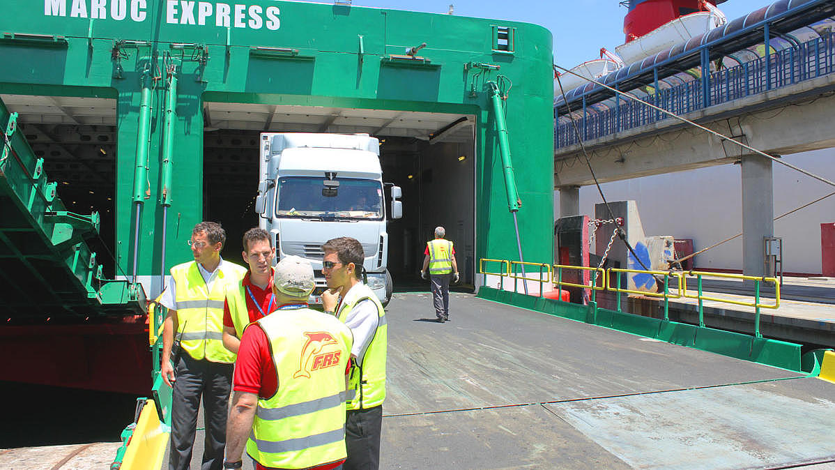 The vehicle deck on a cargo ship.