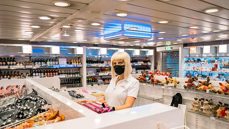 Woman standing at the buffet on the "Skane Jet".