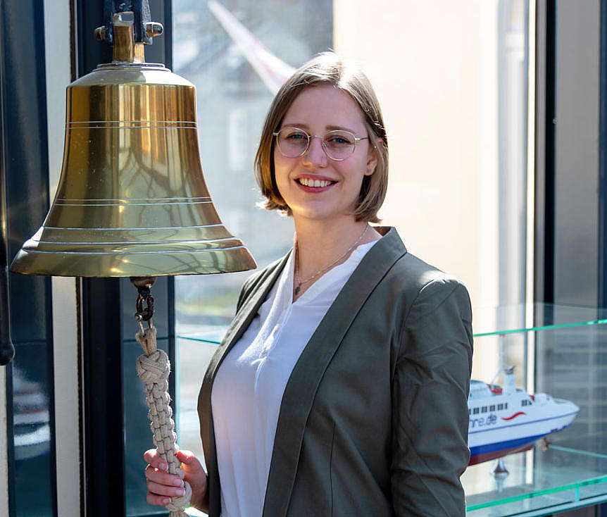 Apprentice ringing a bell.