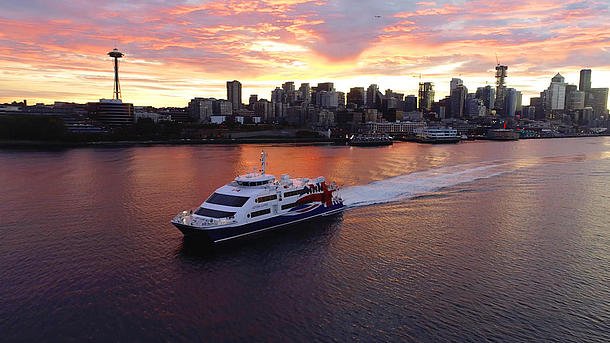 Victoria Clipper V vessel on the water at sunset.