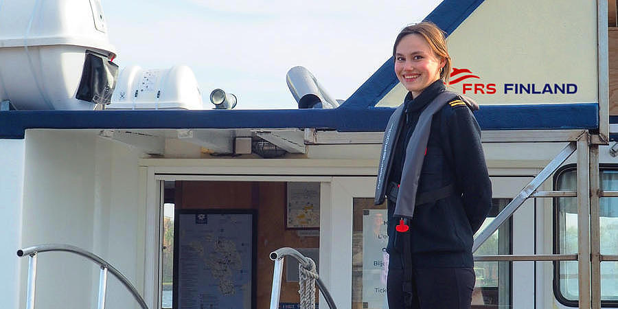 female employee standing on a vessle 