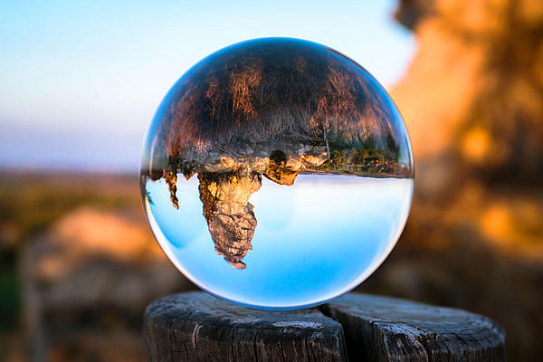a bubble containing a big rock.