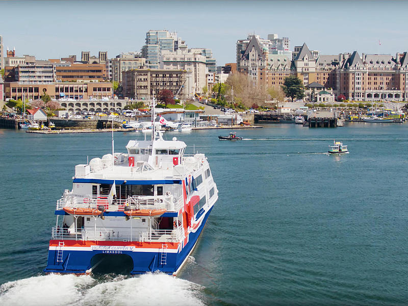 Shows Clipper V approaching the port