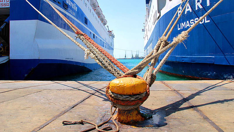 Mooring ropes and two vessels.