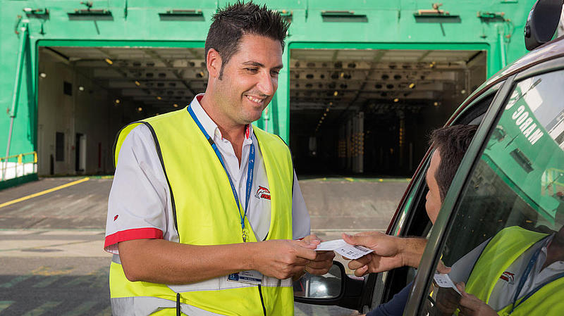 Employee controlls tickets during the loading of the "Maroc Express".
