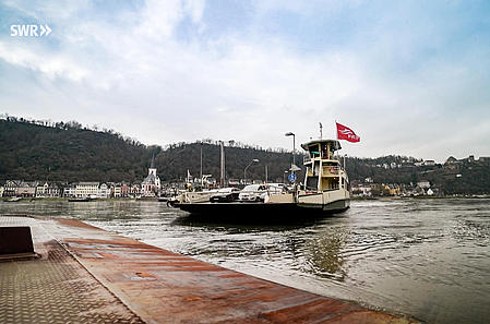 A ferry docks on the Rhine