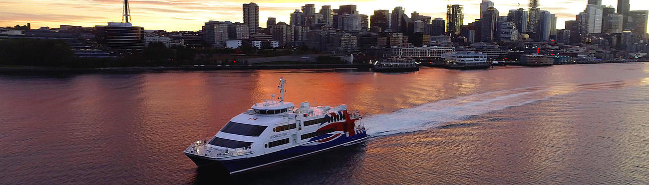 Victoria Clipper V vessel on the water at sunset.
