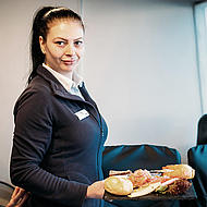 FRS stewardess employee serving breakfast